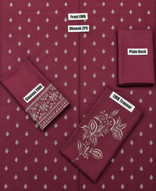 A maroon fabric set laid out on a white background, including a kurta front and back, a plain back piece, a sleeve, and an embroidered trouser. The fabric has a small repeating white motif, and the embroidered trouser shows a larger floral design in a light metallic thread.